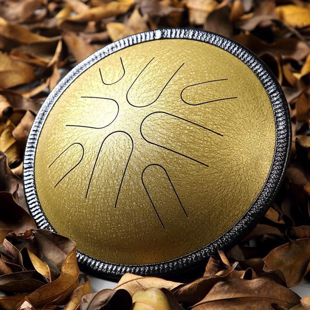Gold circular drum with sun design, part of 10-Inch Copper Disc Steel Tongue Drum