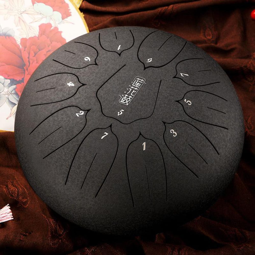Black steel tongue drum with numbered tone markings, 12 inch, C key, 11-tone design