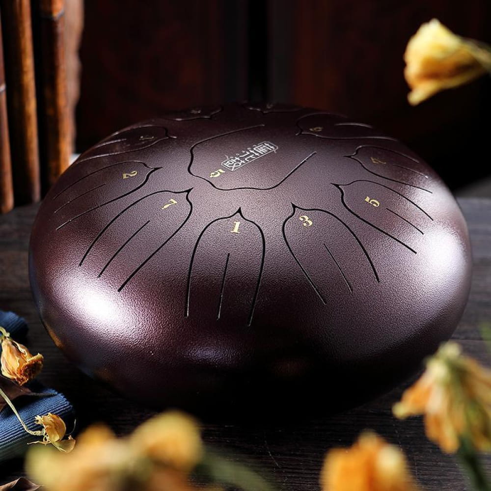 Dark metallic 12 inch Carbon Steel Tongue Drum with etched tone patterns, 11-tone C key