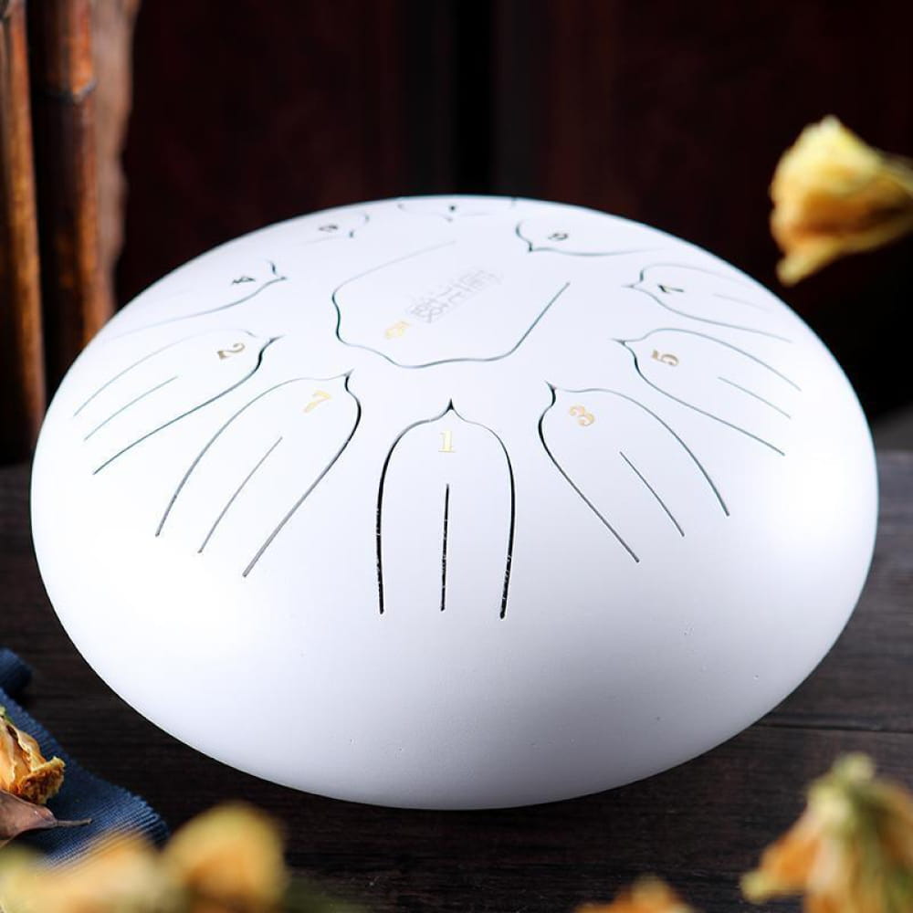 White oval drum with etched designs, 12 Carbon Steel Tongue Drum in C Key