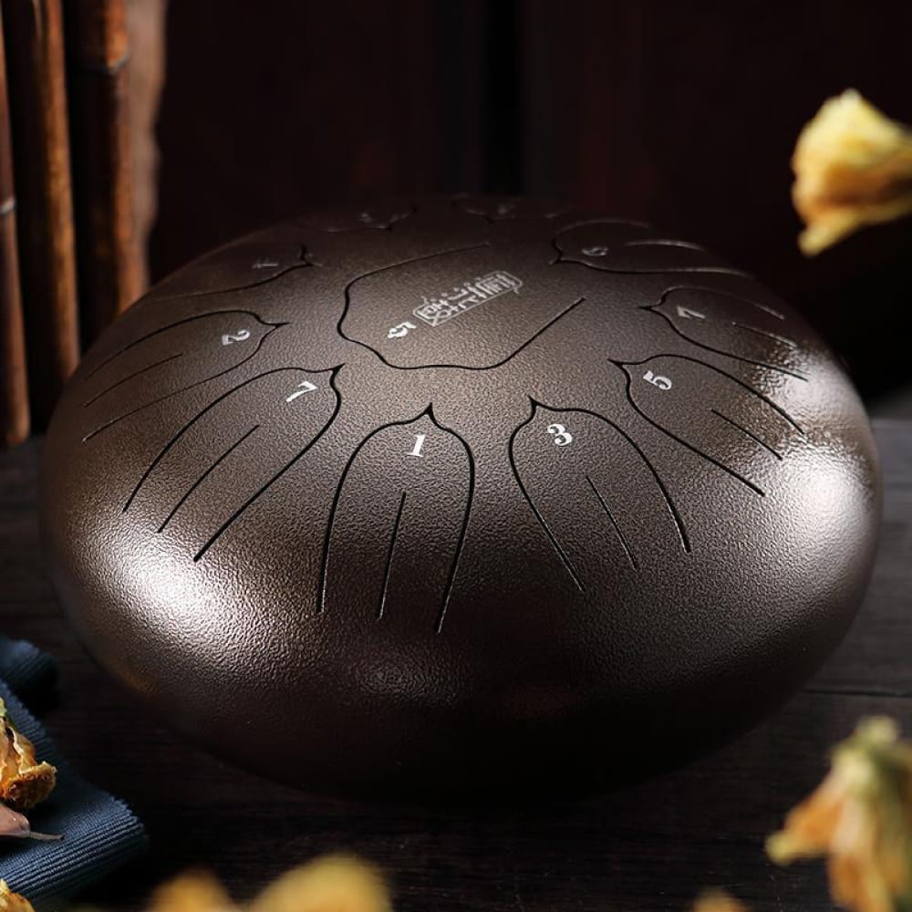 Dark metallic 12 inch Carbon Steel tongue drum with petal patterns, 11-tone C key