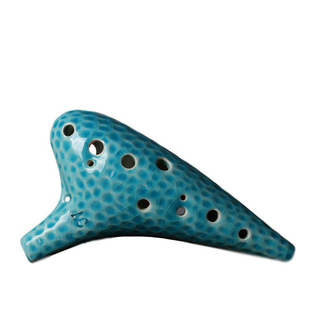 Turquoise ceramic 12 Hole Alto C Ocarina with black holes and spotted glaze pattern