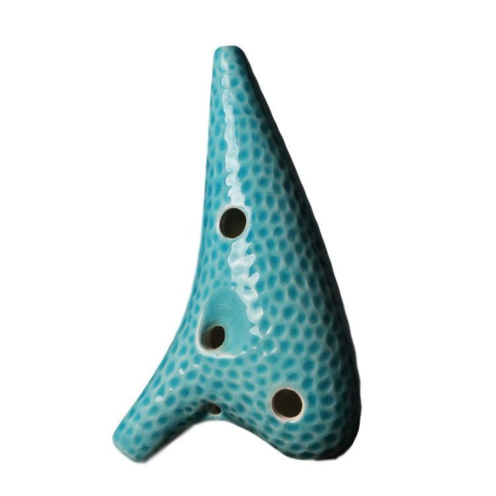 Turquoise ceramic 12 Hole Alto C Ocarina with black dots and dimpled texture