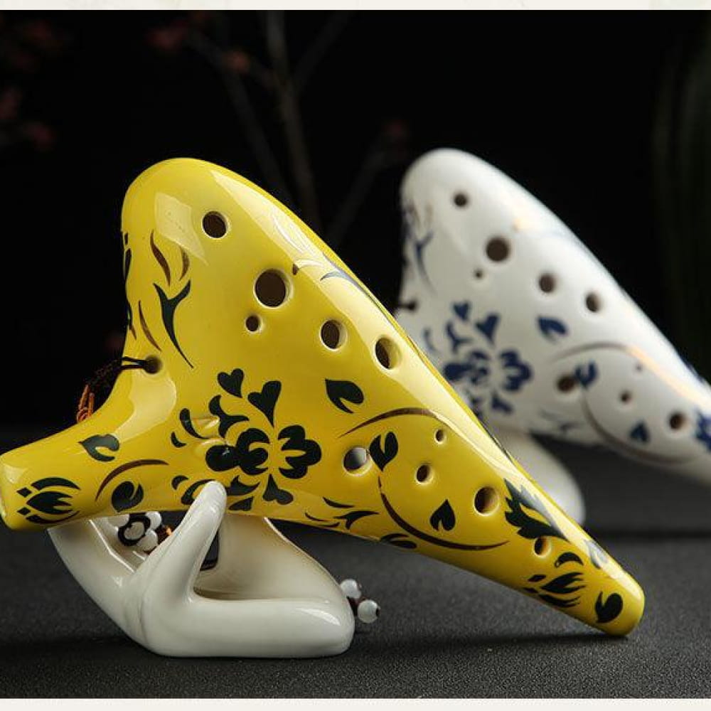 Yellow ceramic ocarina with black floral patterns from 12 Hole Alto C Ceramic Ocarina Flute Instrument