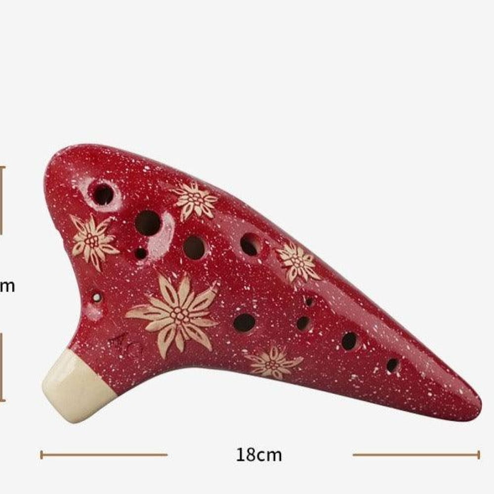 Red ceramic ocarina with snowflake patterns for Zelda music lovers