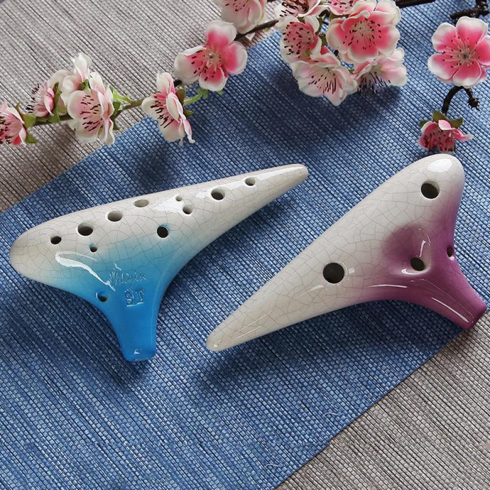 Two gradient blue and pink ceramic ocarinas with finger holes for wind instrument