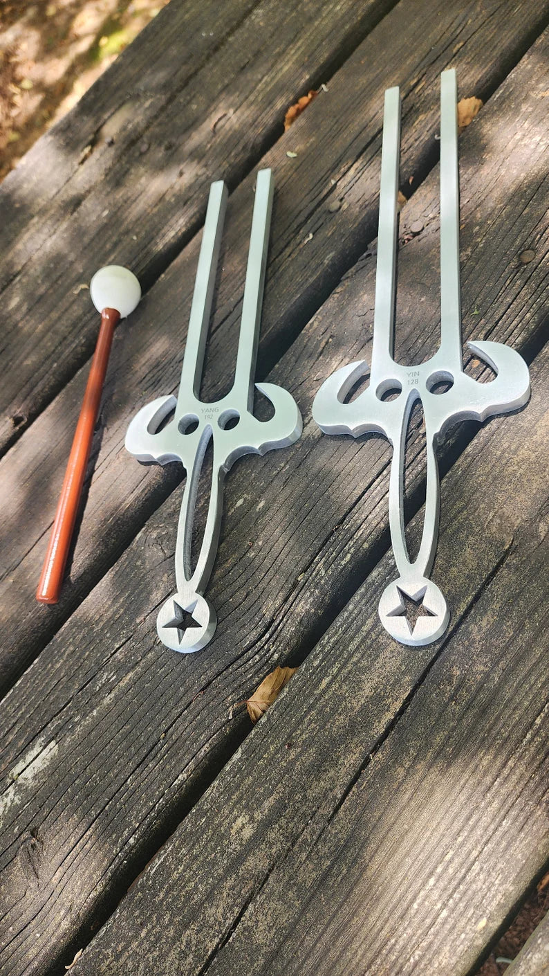 Three foam toy swords with round pommels and decorative crossguards for play