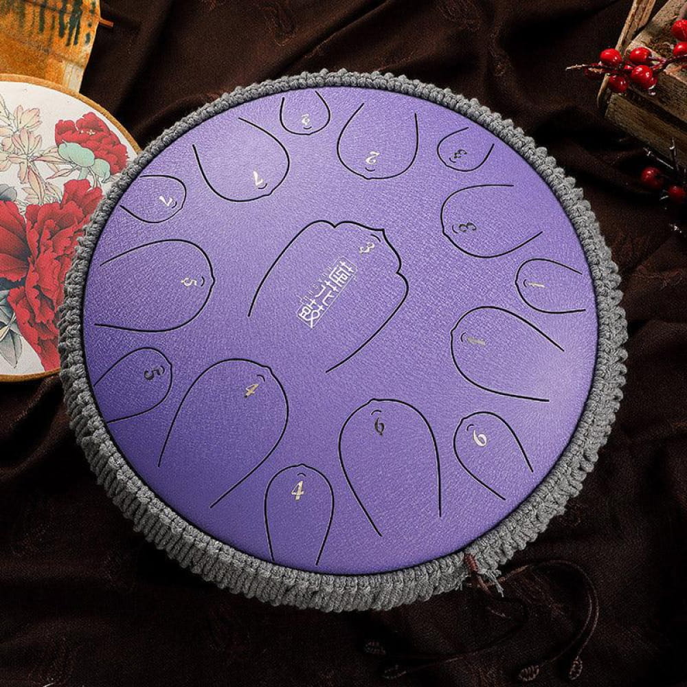 Purple steel tongue drum with 15 notes in D key arranged in a circular pattern
