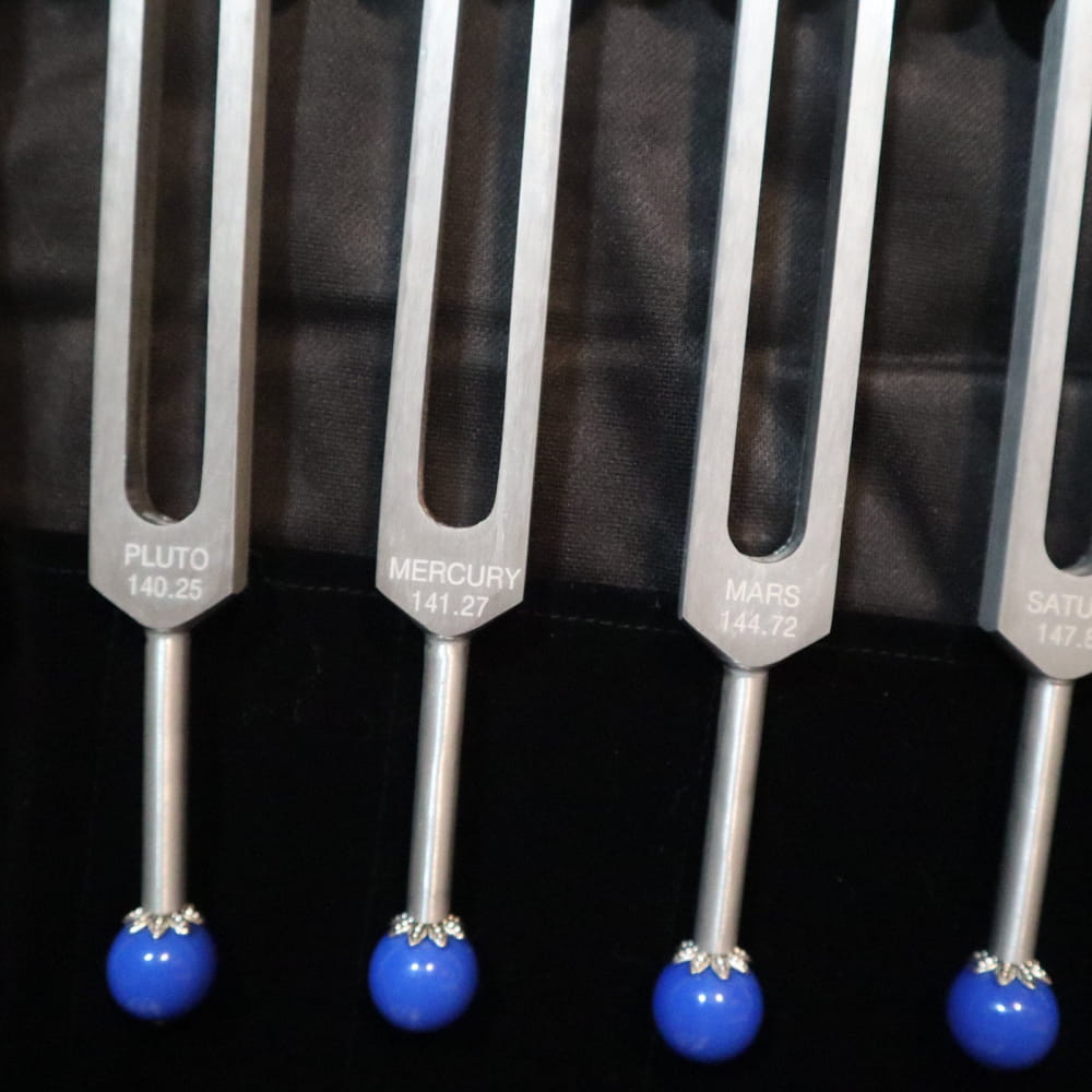 Tuning forks with blue spherical tips from 19pc Chakra & Planetary Tuning Fork Set