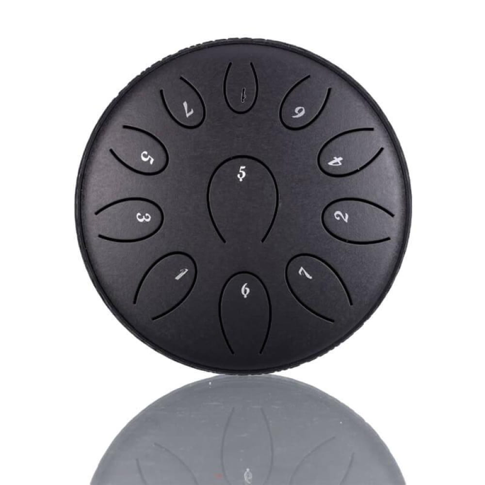 Black steel tongue drum with numbered petal tone zones in circular pattern C/D Major