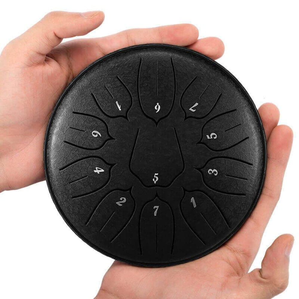 Black circular steel tongue drum with numbered tone zones in Lotus design