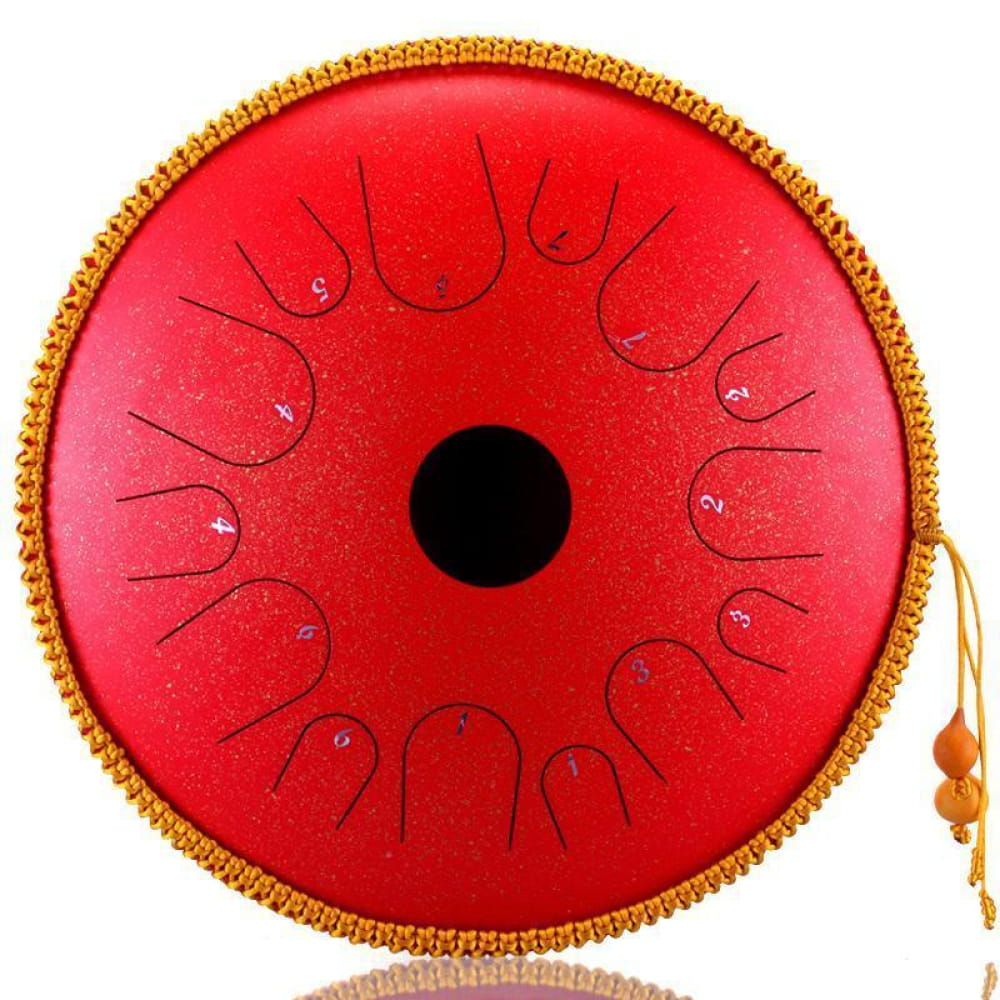 Red steel tongue drum with gold trim and tassels, perfect for beginners and kids