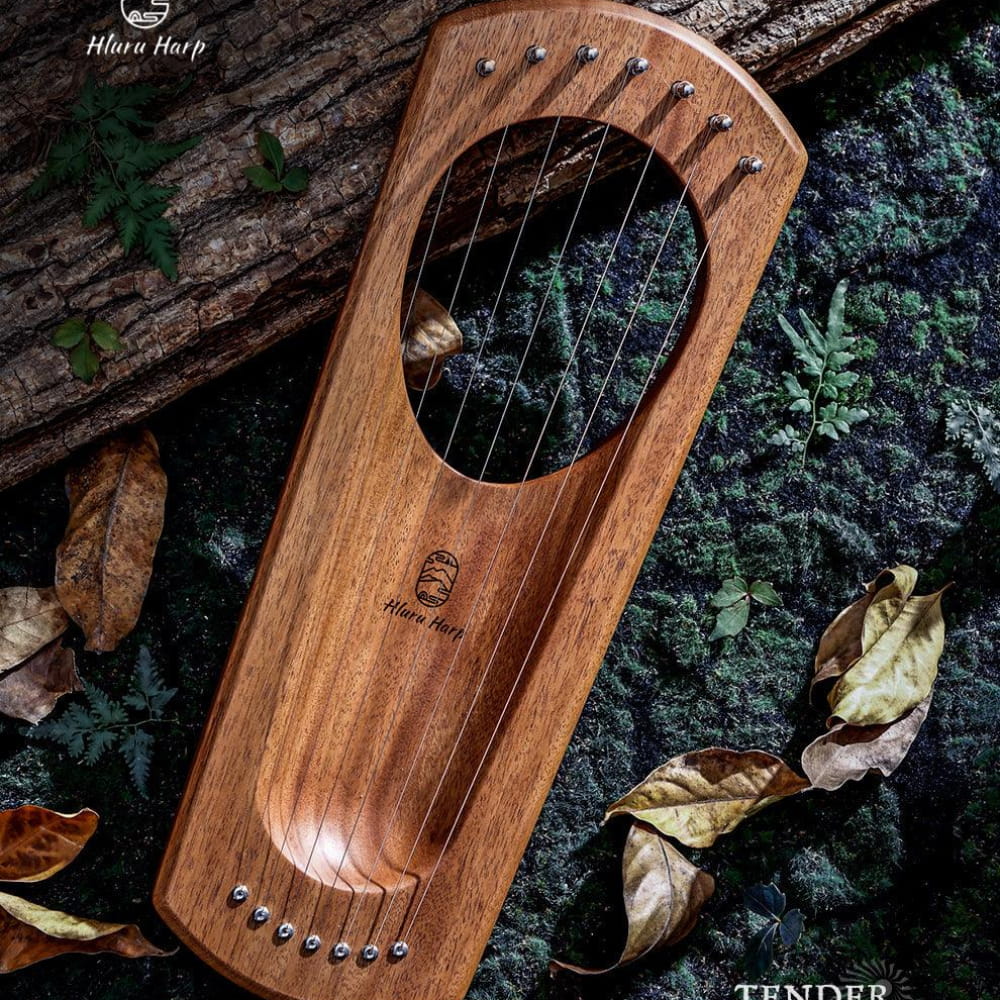 Wooden 7-String Mini Lyre Harp Instrument with Metal Strings on Dark Surface