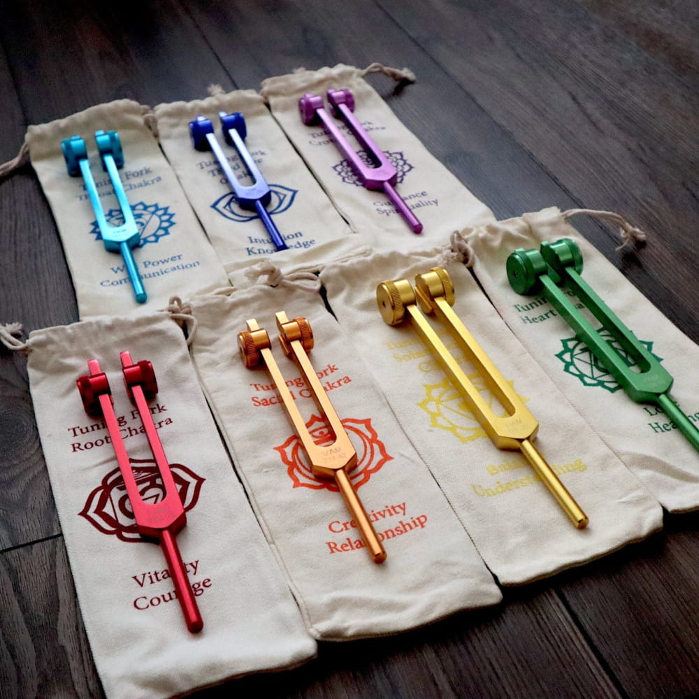 Colorful Chakra Tuning Fork Set with matching fabric pouches for sound therapy