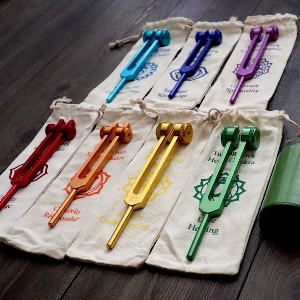 Colorful 7pc Chakra Tuning Fork Set with matching cloth pouches in rainbow order
