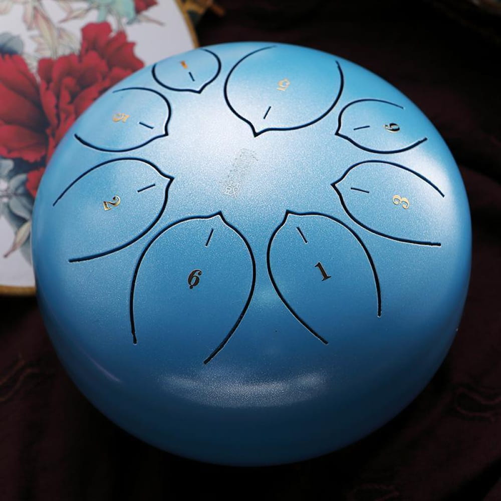 Light blue 8-inch Carbon Steel Tongue Drum with petal-shaped tone markings in F Key
