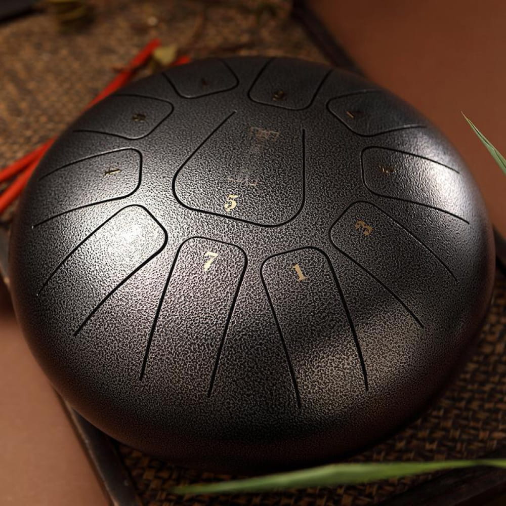 8-inch Square Steel Tongue Drum with etched tones in circular pattern, 11 notes in F key