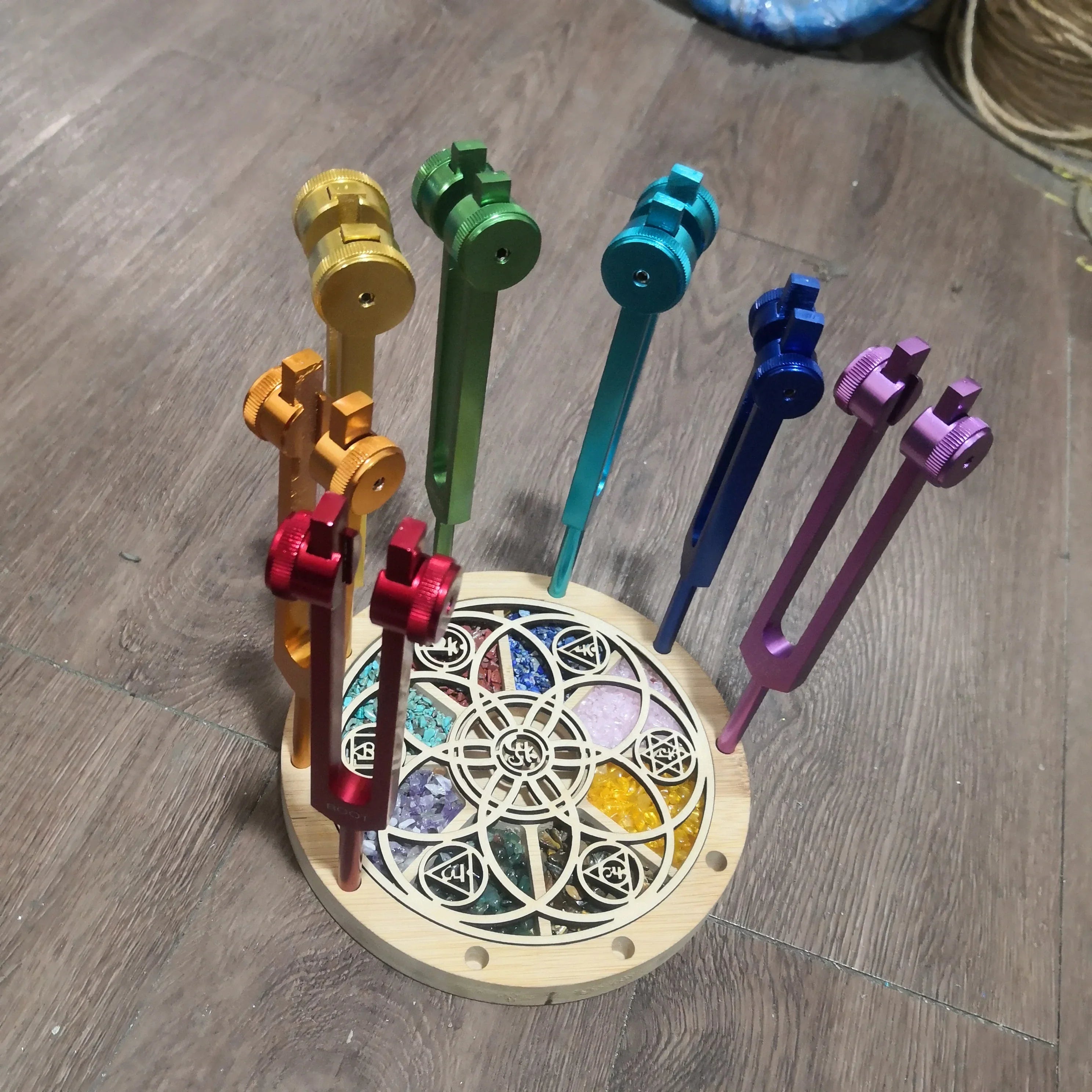 Colorful metal keys in circular wooden holder with stained glass design Chakra Tuning Fork Stand