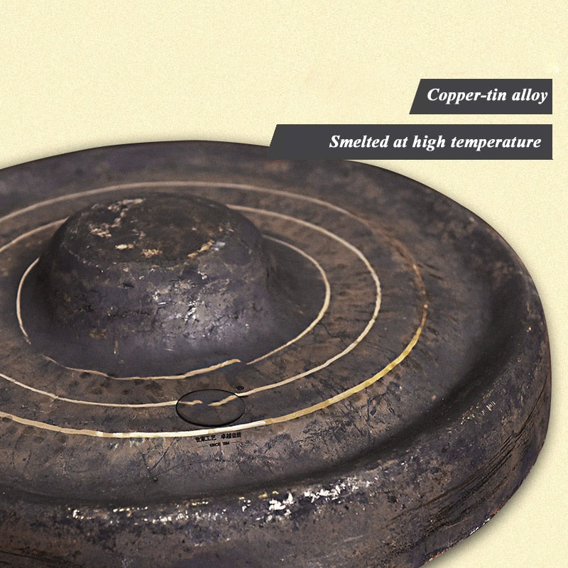 Dark metallic disc with grooves, Chinese Bao Gong Instrument for meditation
