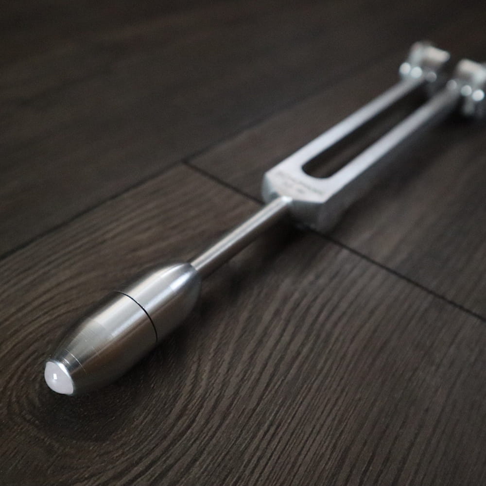 Medical reflex hammer for neurological tests alongside Crystal & Onyx Massage Handles