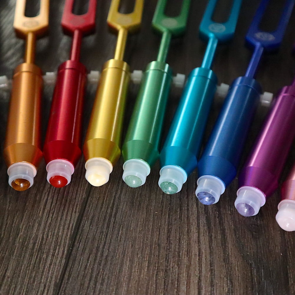 Colorful gel pens in rainbow sequence for Gemstone Aromatherapy Tuning Forks Extensions