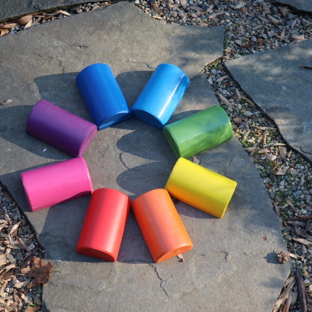 Colorful drink koozies in a rainbow circle for Healing Tuning Fork Activators