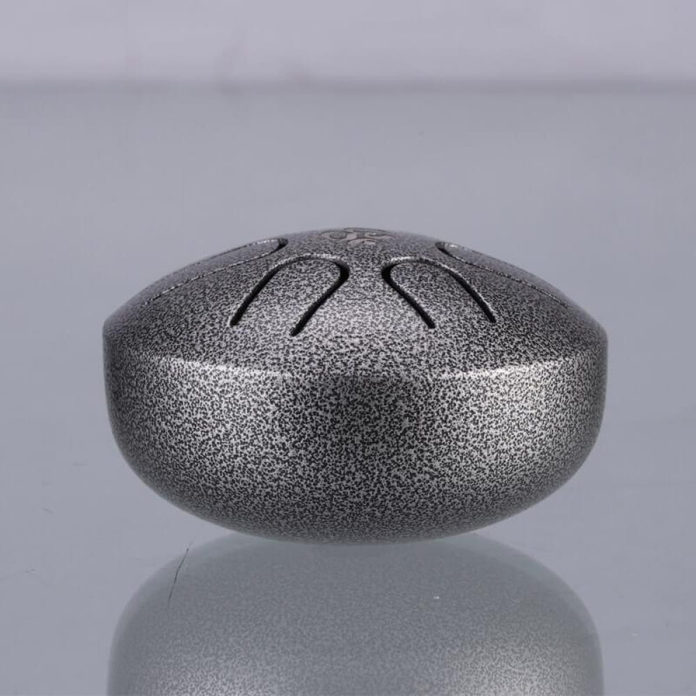 Metallic steel-colored Mini Titanium Steel Tongue Drum with textured finish