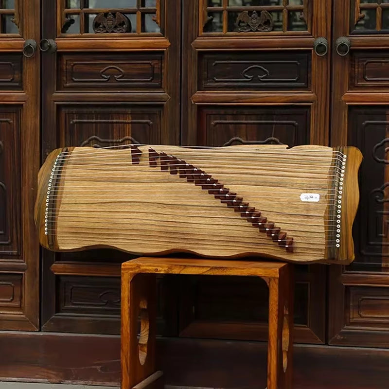 Traditional Japanese Koto stringed instrument on a wooden stand, showcasing exquisite craftsmanship