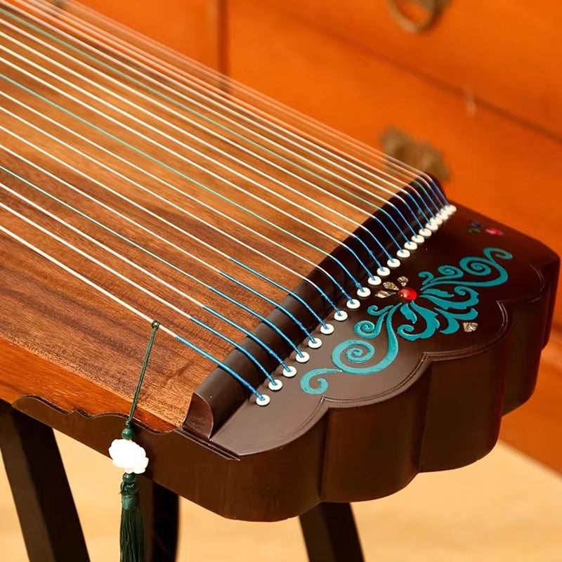 Chinese Guzheng with turquoise swirl patterns on dark wooden bridge in 100 cm Paulownia model