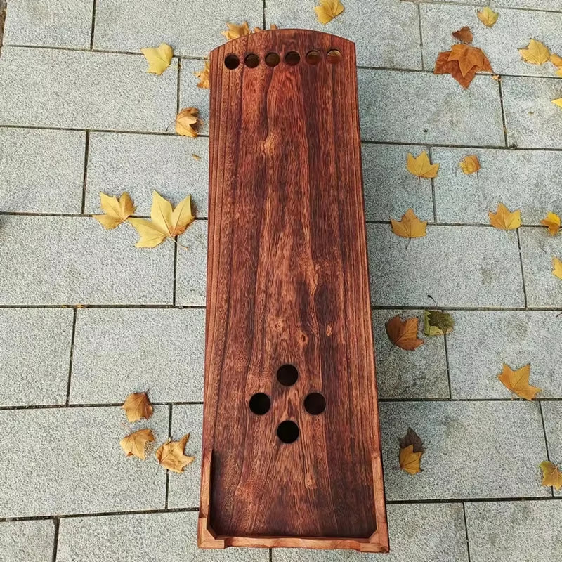 Wooden incense holder with multiple holes for burning sticks in Guzheng Zither display