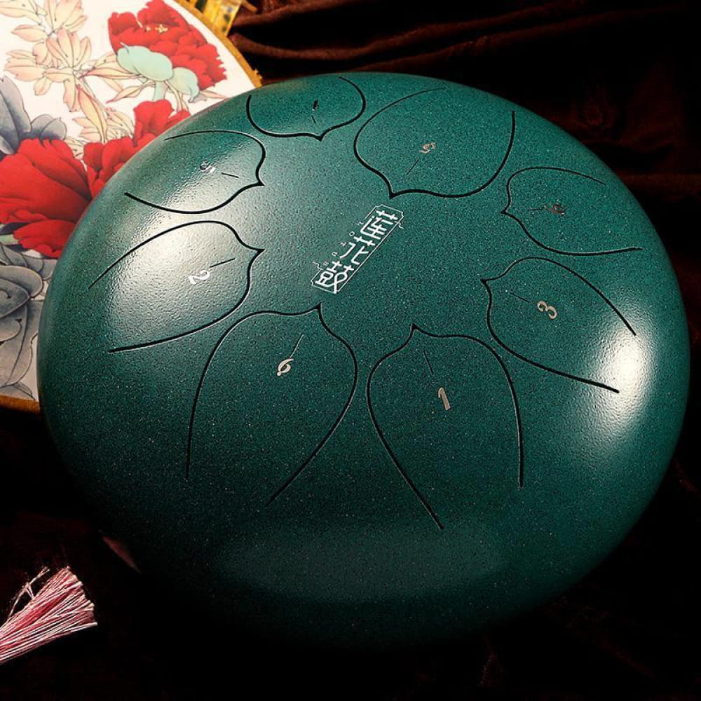 Teal Carbon Steel Tongue Drum with petal tone markings for portable music in C key