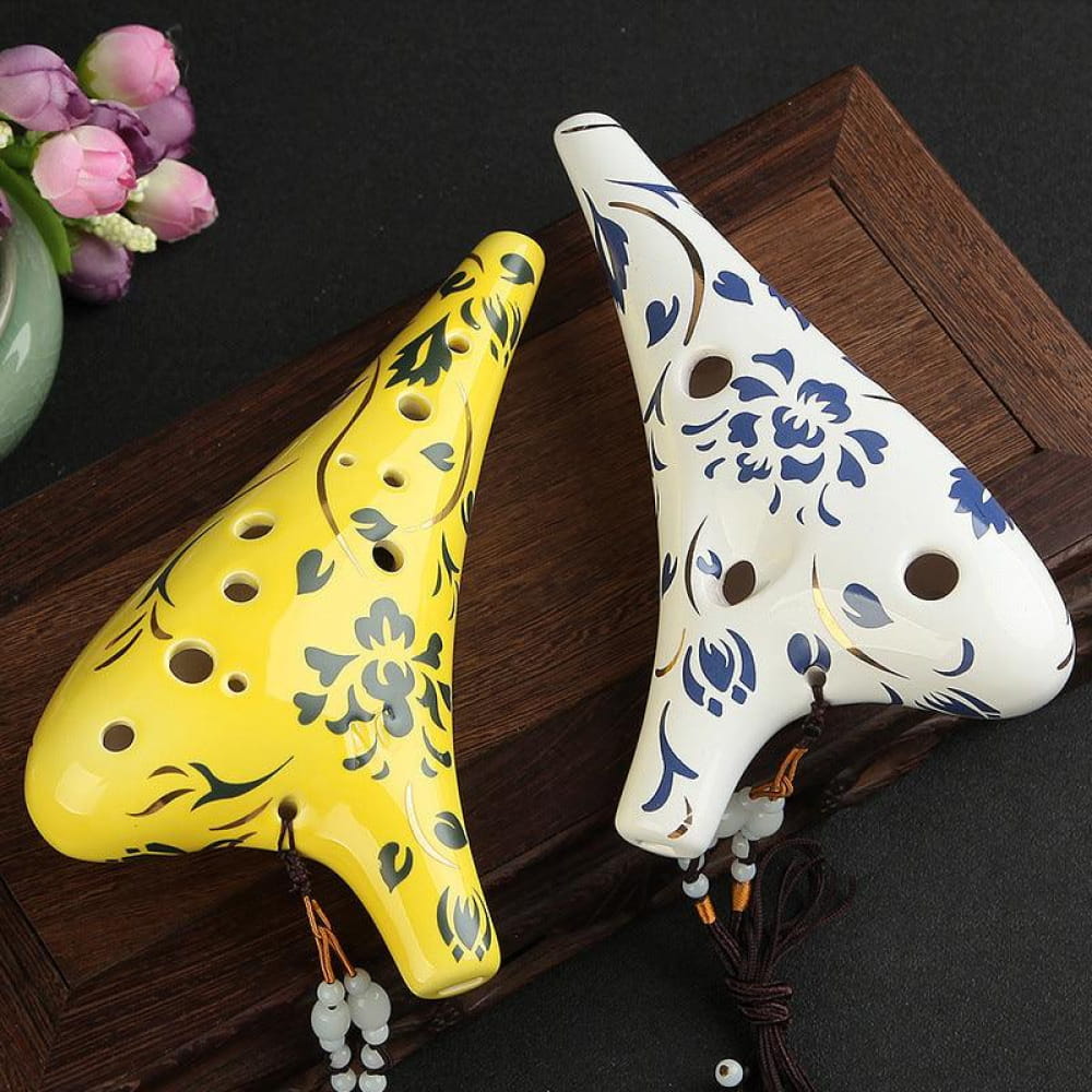 Two floral-patterned yellow and white ceramic ocarinas for 12 Hole Alto C flute