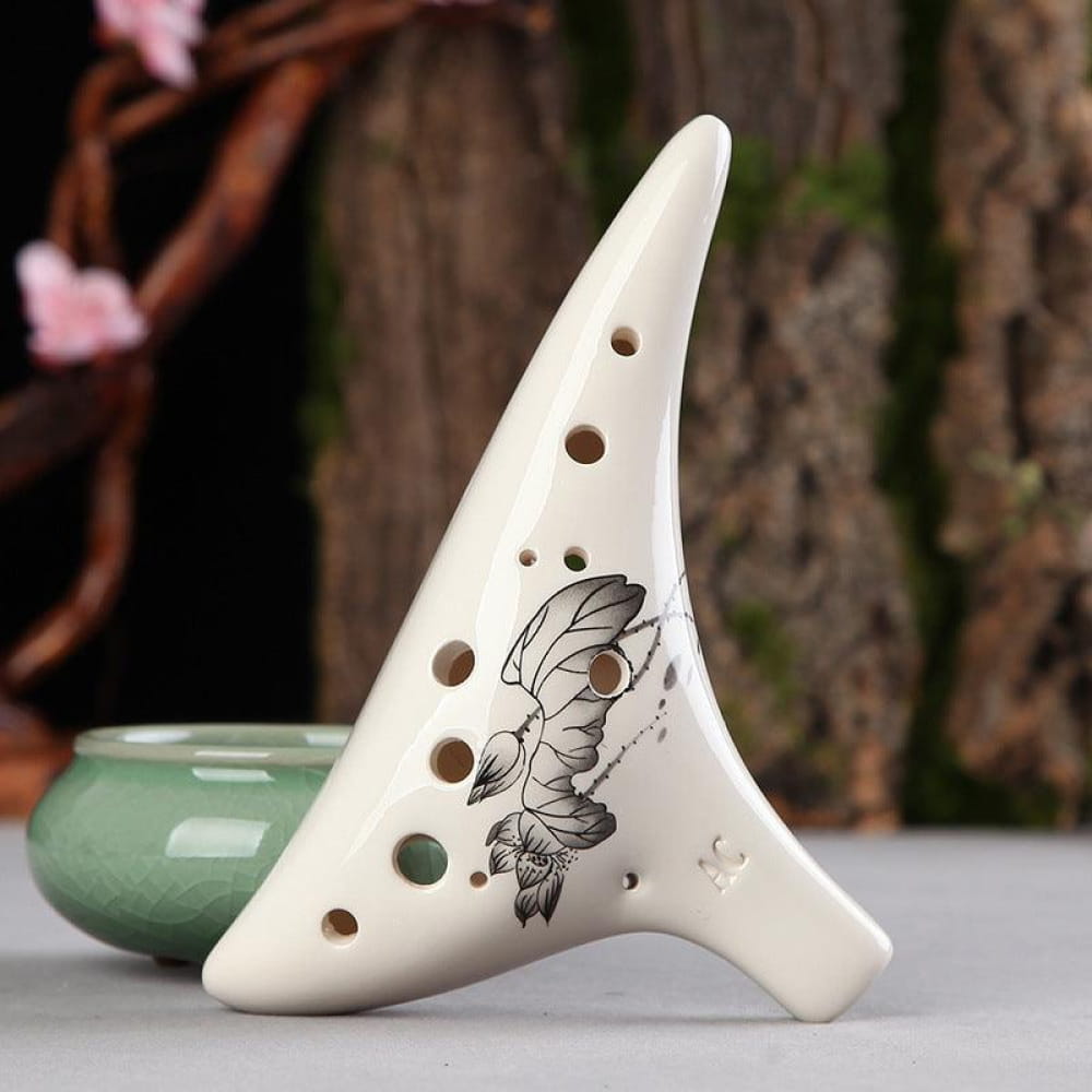 White ceramic 12 Hole Alto C Ocarina with butterfly design and finger holes