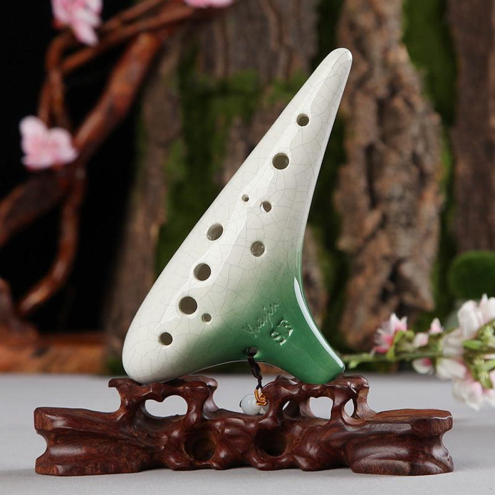 White and green ceramic ocarina on wooden stand for 12 Hole Soprano Treble Ocarina