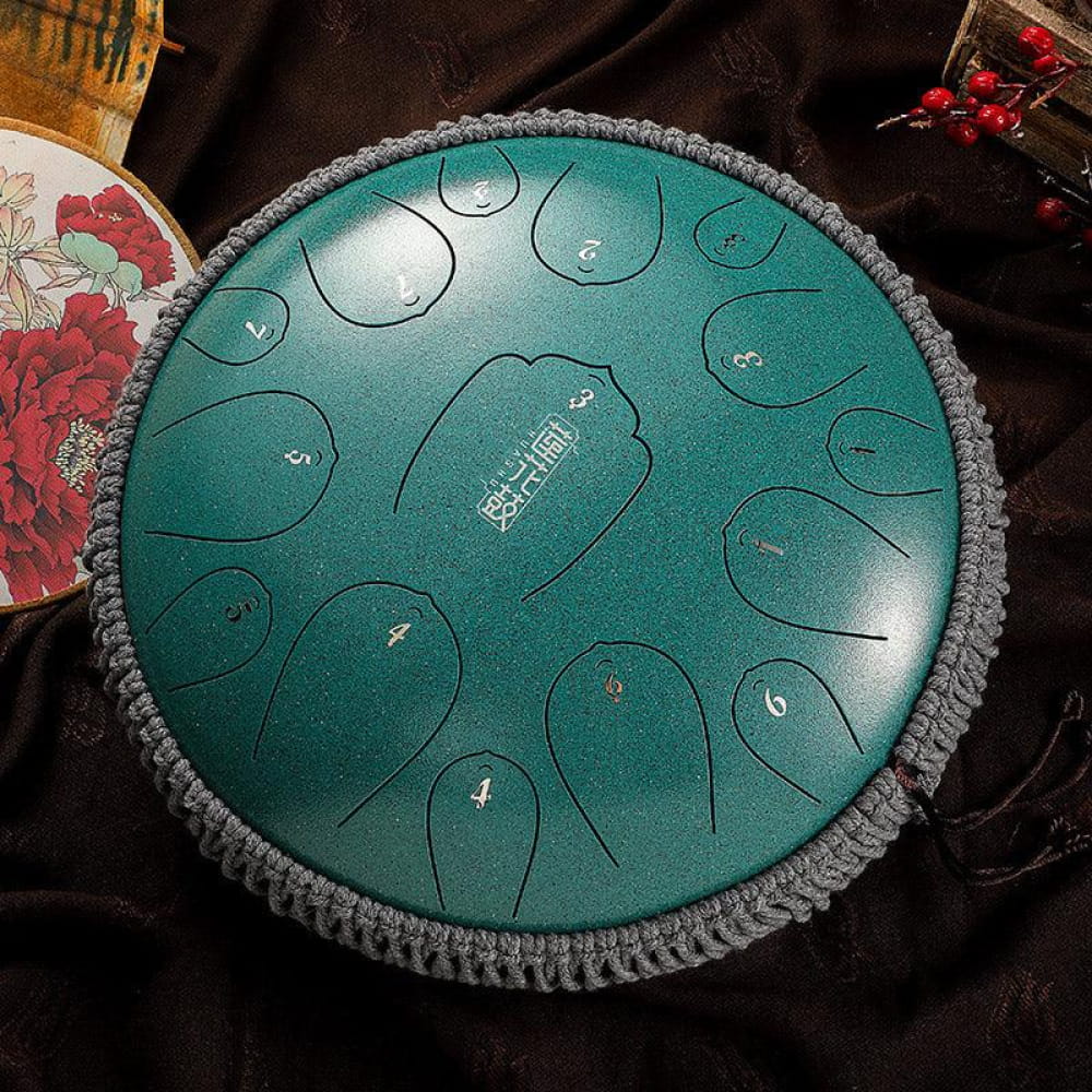 Teal Carbon Steel Tongue Drum with numbered zones and gray knitted border, 13 inches