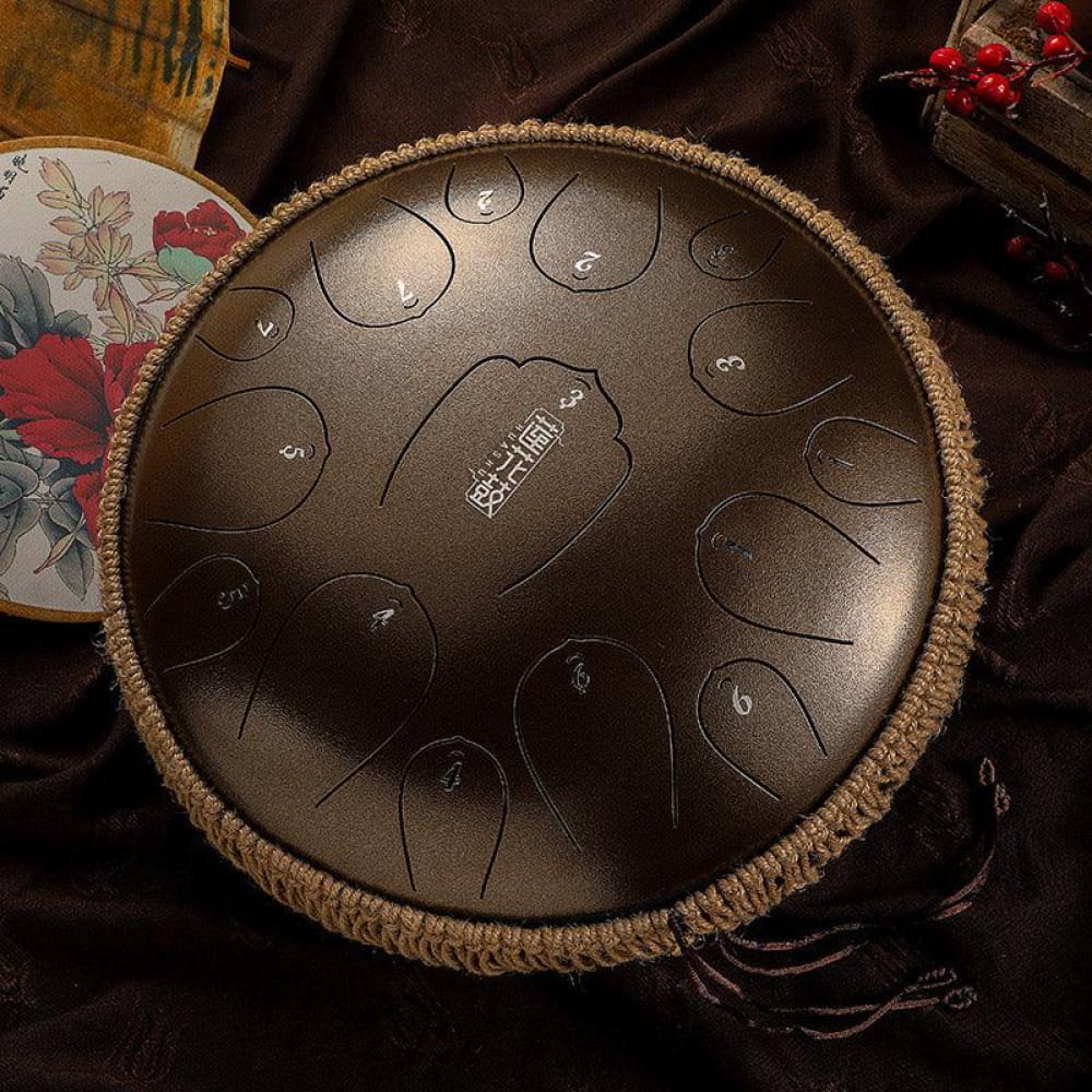 13-Inch Carbon Steel Tongue Drum with numbered tones and woven rope trim in C Key