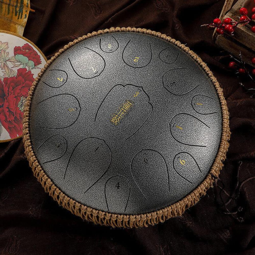 Steel tongue drum with woven rope border and marked zones, 13-inch D Key model