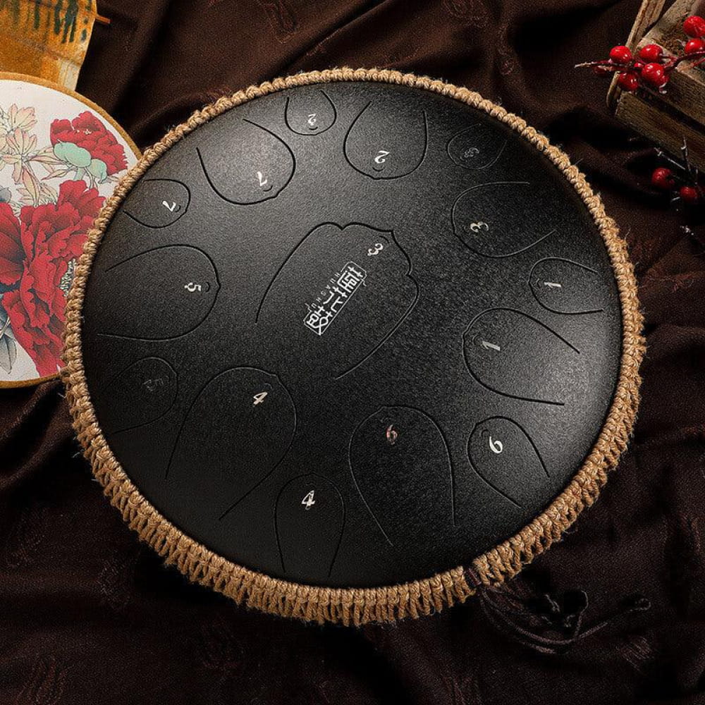 Black steel tongue drum with numbered tone zones and rope trim, 14-Inch D Key instrument