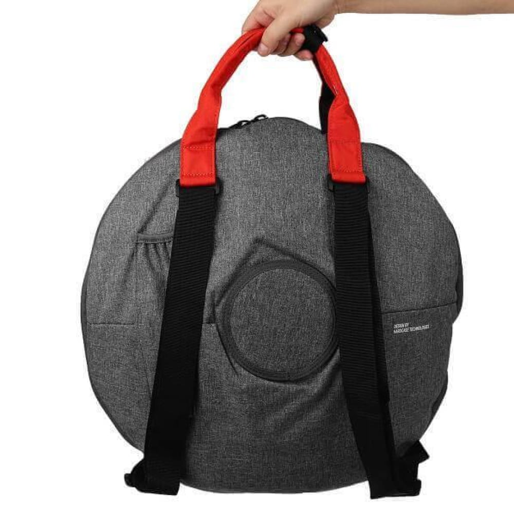 Grey circular carrying bag with red handles and black straps for 14 Inch Tongue Drum