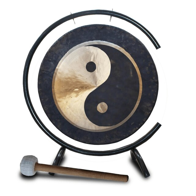 Circular Yin-Yang gong with wooden mallet on metal stand for meditation use