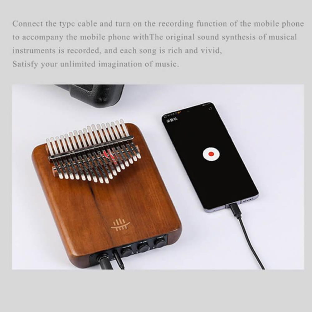 Wooden Kalimba thumb piano with metal tines connected to a mobile phone for music