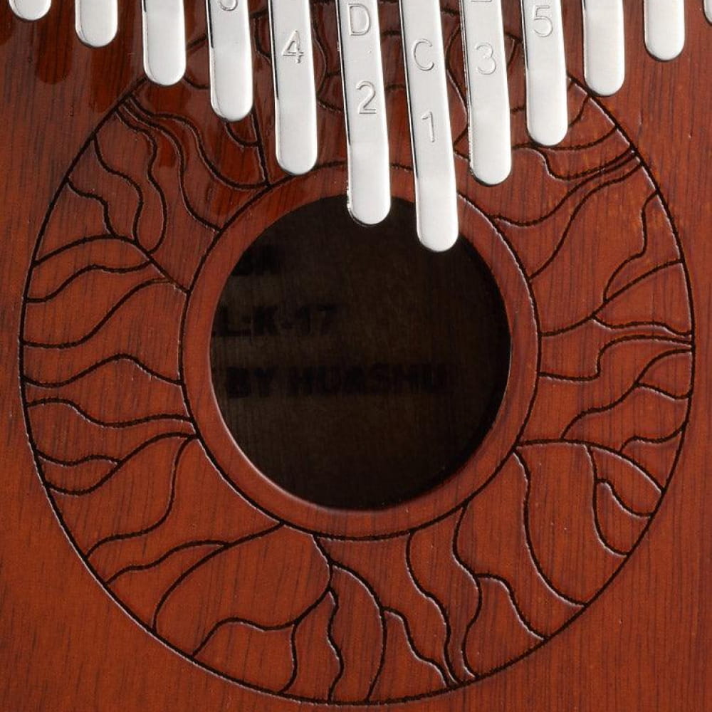 Wooden Kalimba with decorative patterns and central sound hole featured in 17 Key Acacia Armrest model