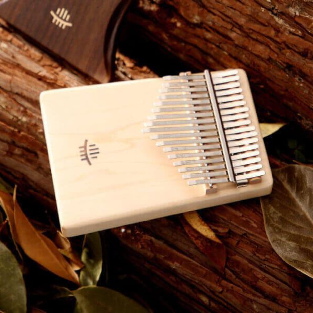 Cream-colored 17 Key Maple C Tone Kalimba Thumb Piano with ascending metal tines