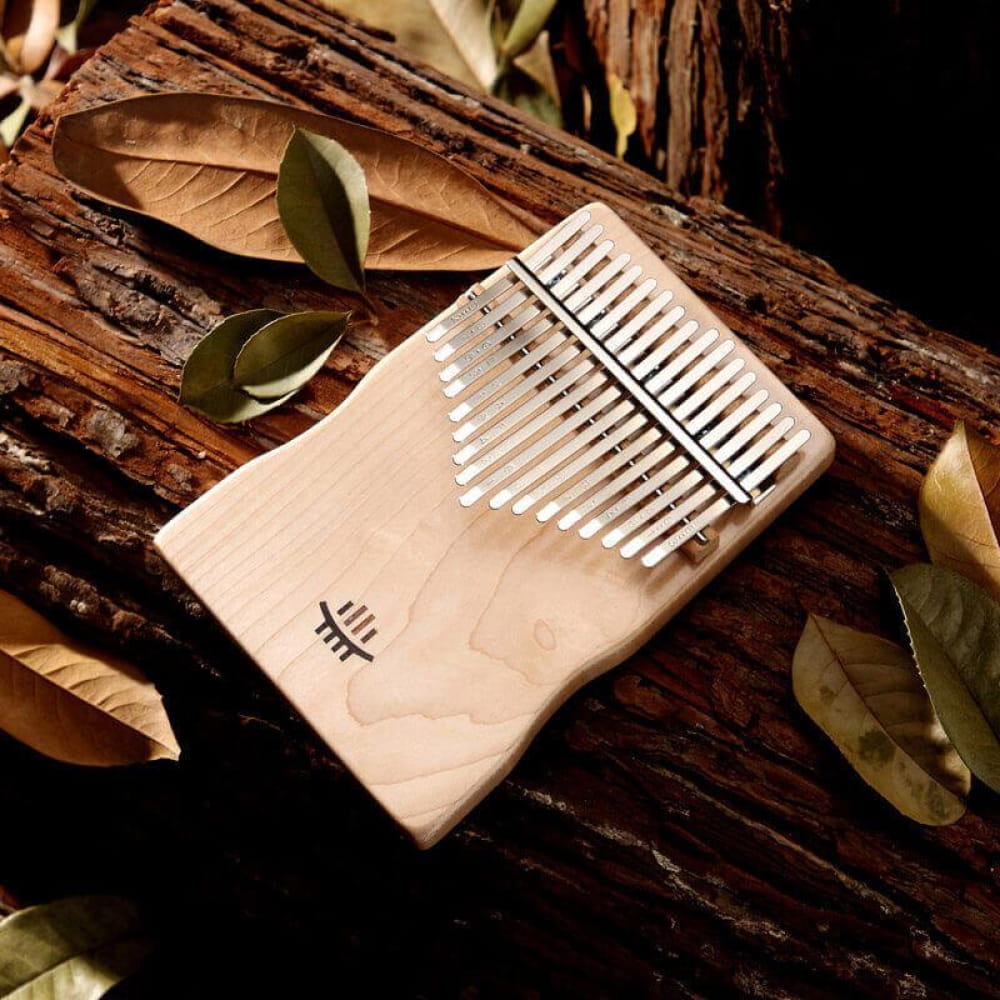 Wooden Kalimba thumb piano with metal tines in 17 Key Maple C Tone design for meditation