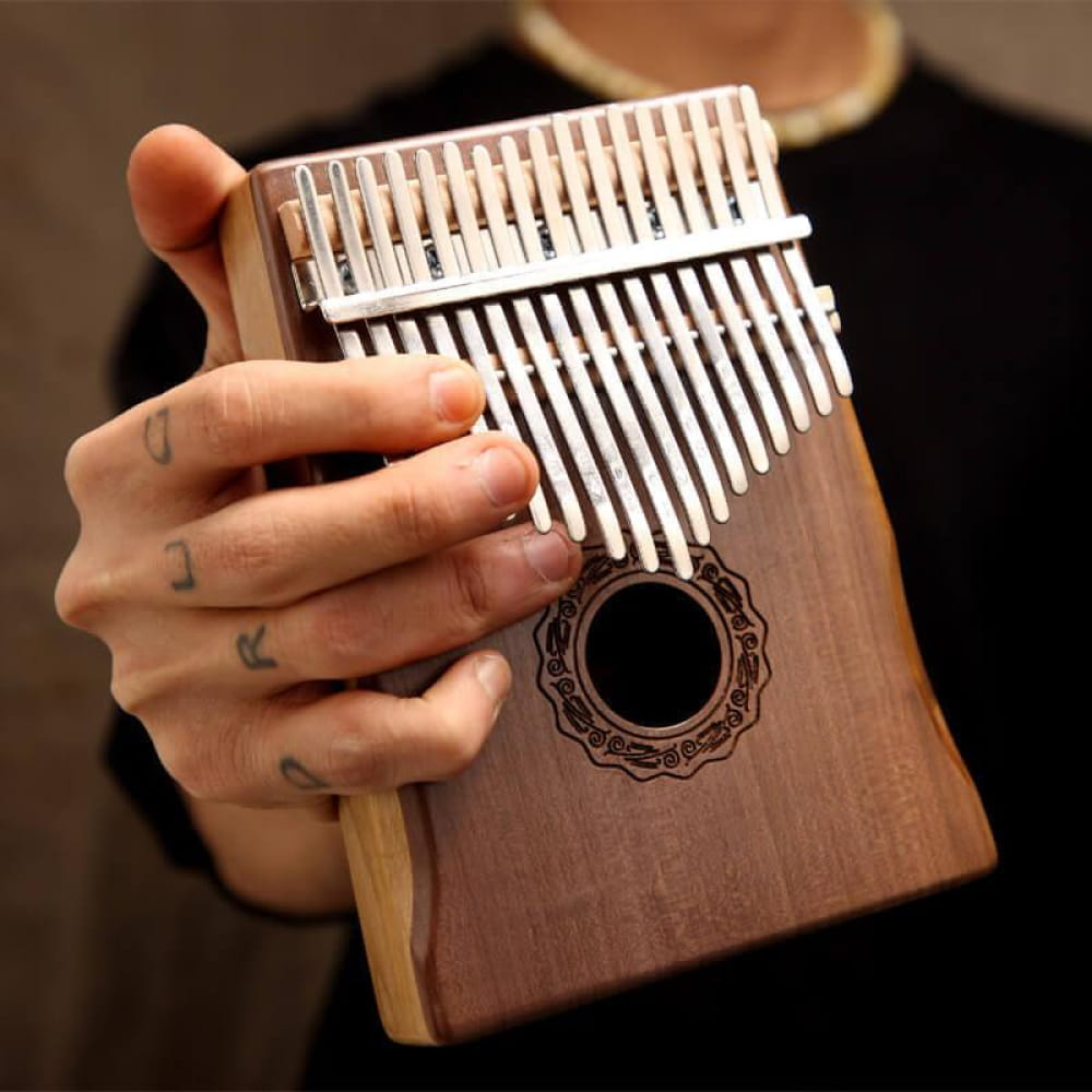 Wooden 17 Key Walnut Kalimba Thumb Piano with metal tines and round decorative hole