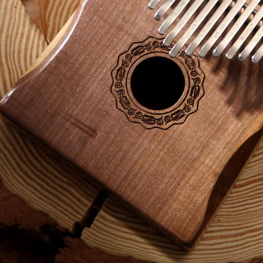 Wooden Kalimba C Tone with carved sound hole and metal tines, 17 Key Walnut design