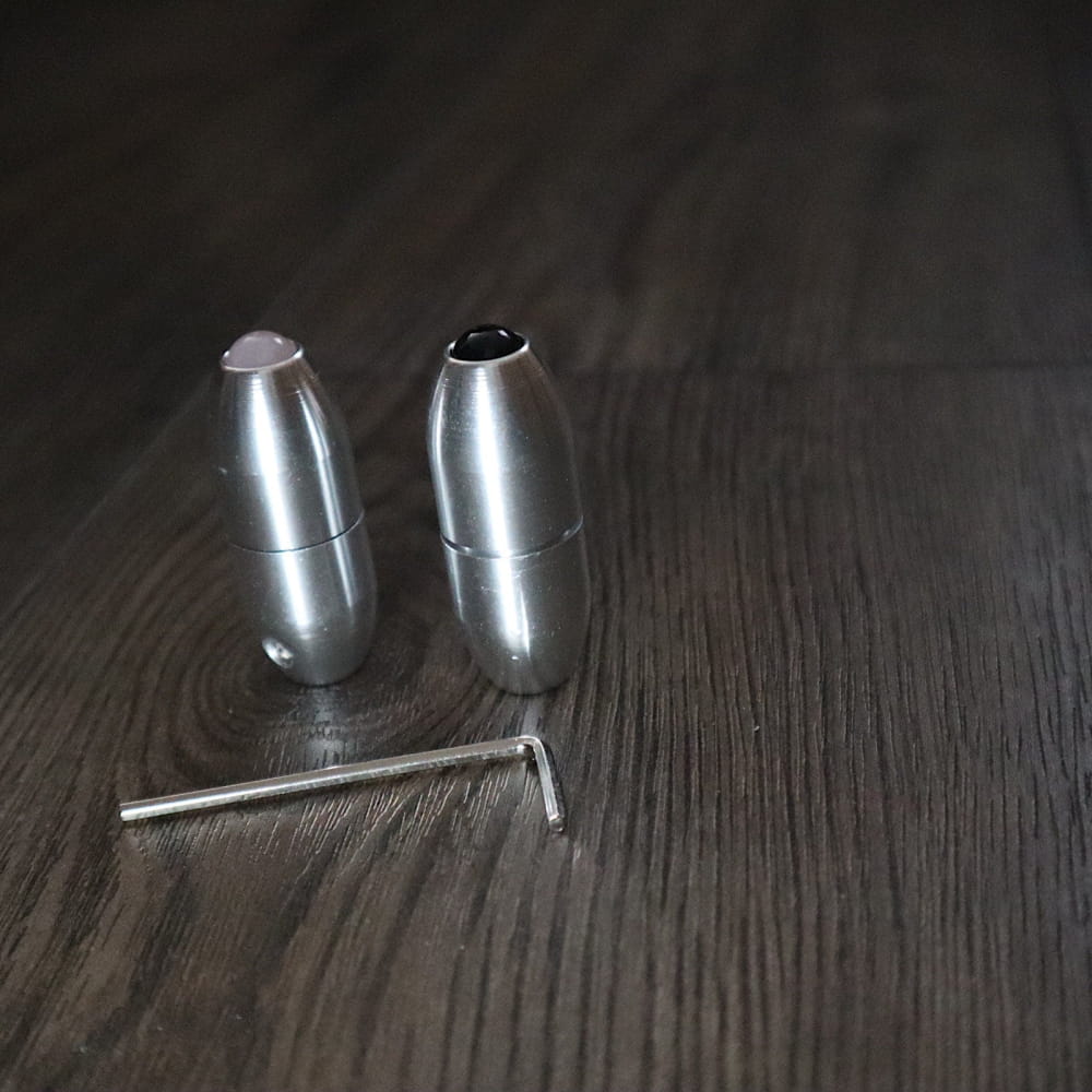 Metallic bullet-shaped salt and pepper shakers with serving tool in healing forks set
