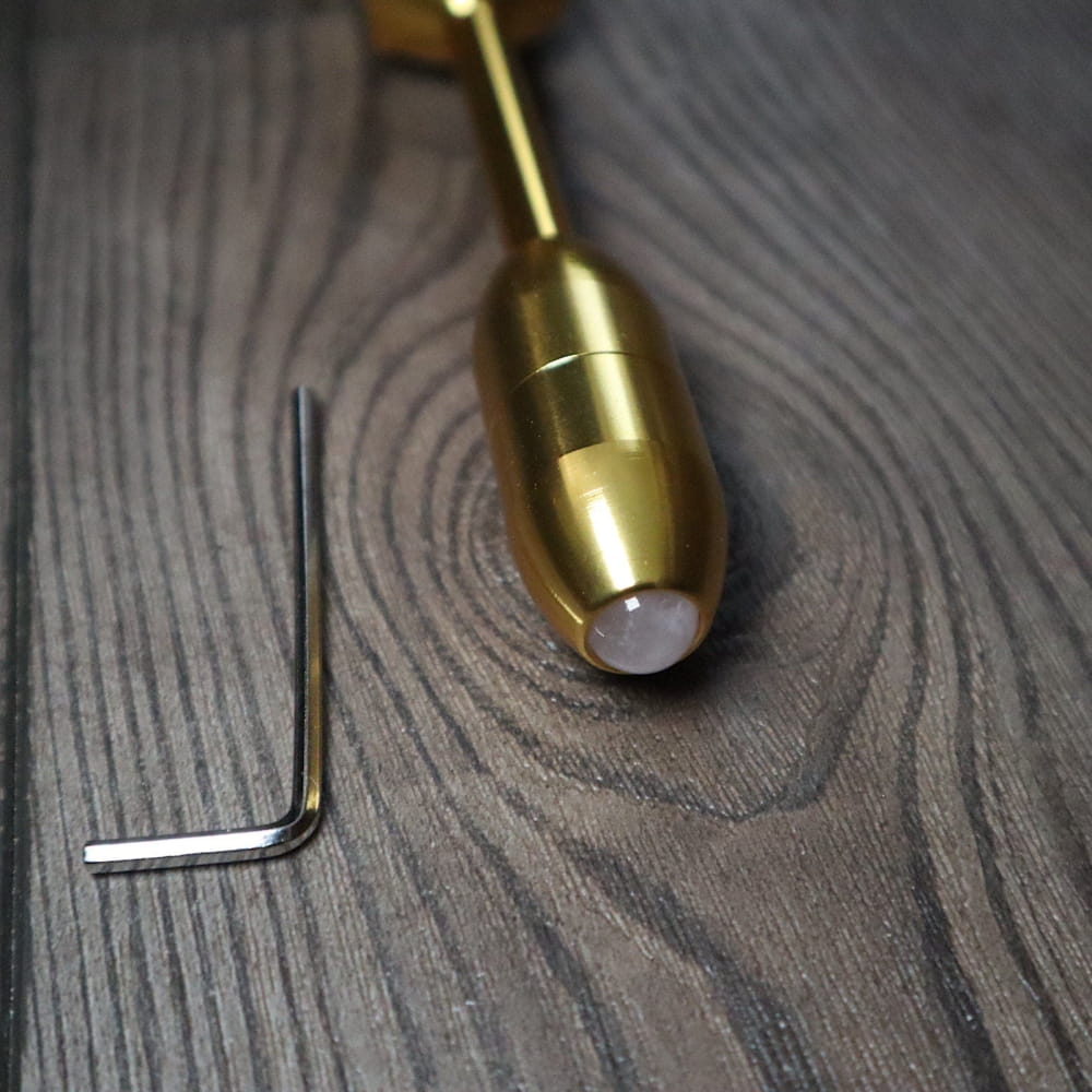 Brass tuning fork with white tip, designed for 174 Hz and 528 Hz healing therapy