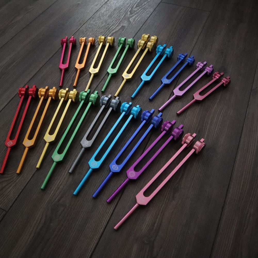 Rainbow-colored tuning forks in spectrum for Solfeggio & Chakra Tuning Fork Set