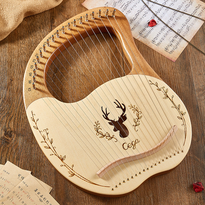 Wooden lyre harp with deer silhouette and floral design on soundboard for music lovers
